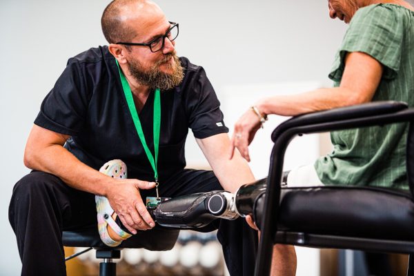 Photo: fitting and testing a prosthetic Powerknee by Kinneir Dufort